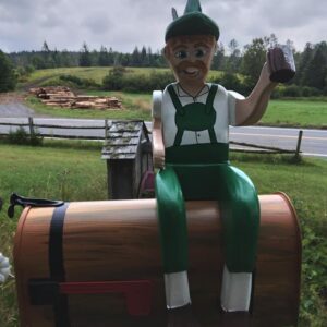 man with barrel mailbox